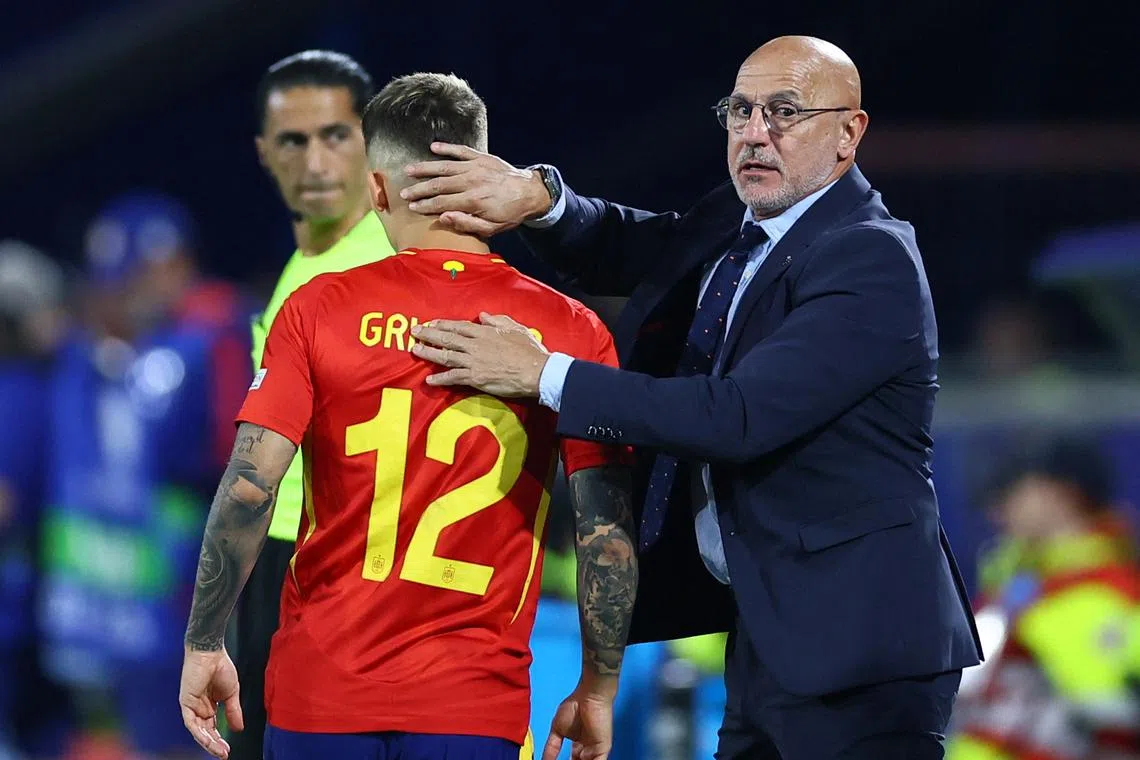 Soccer Football - Euro 2024 - Round of 16 - Spain v Georgia - Cologne Stadium, Cologne, Germany - June 30, 2024  Spain's Alex Grimaldo with coach Luis de la Fuente before he comes on as a substitute REUTERS/Thilo Schmuelgen