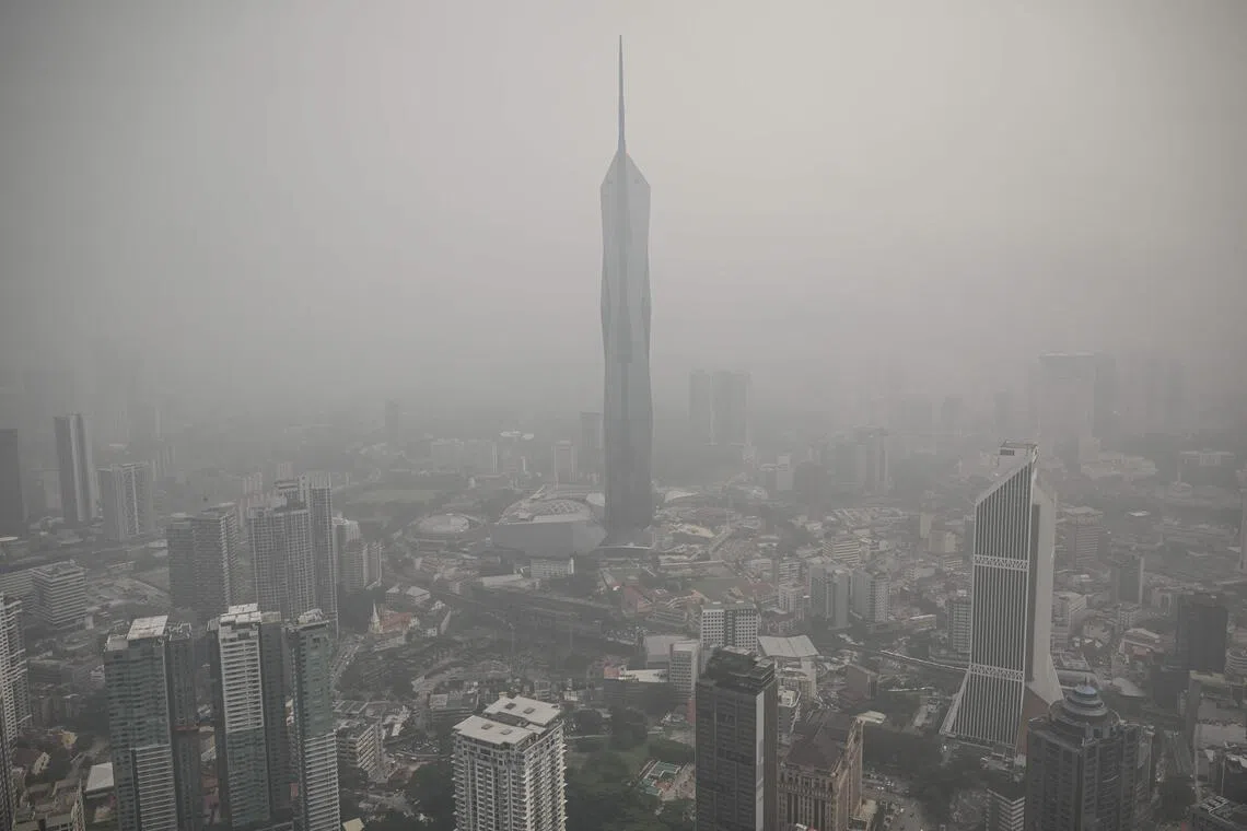 Buildings in Kuala Lumpur on Oct 16 being shrouded in haze caused by fires in Indonesia.