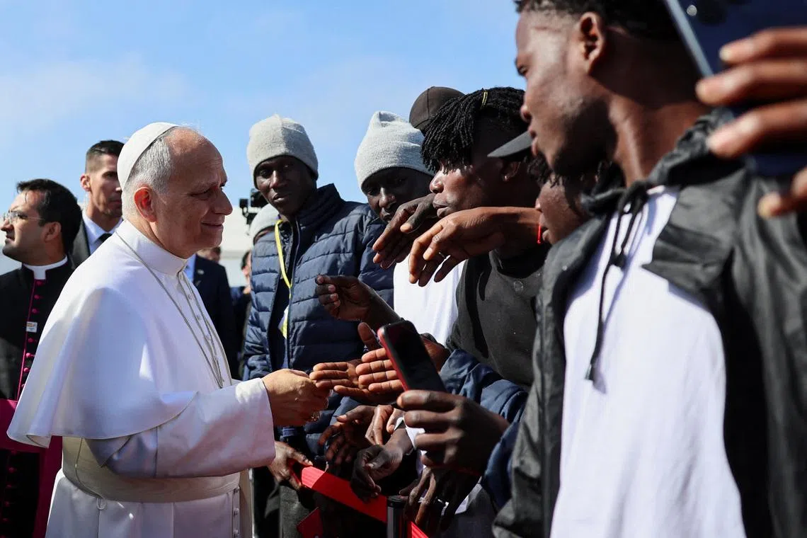 Pope Leo XIV greets migrants at the \"Las Raices\" migrant center in San Cristobal de La Laguna, Tenerife, Canary Islands, Spain, June 12, 2026, where he is meeting migrants and humanitarian organizations, as part of a seven-day apostolic journey to Spain, with visits to Madrid, Barcelona and the Canary Islands. REUTERS/Yara Nardi