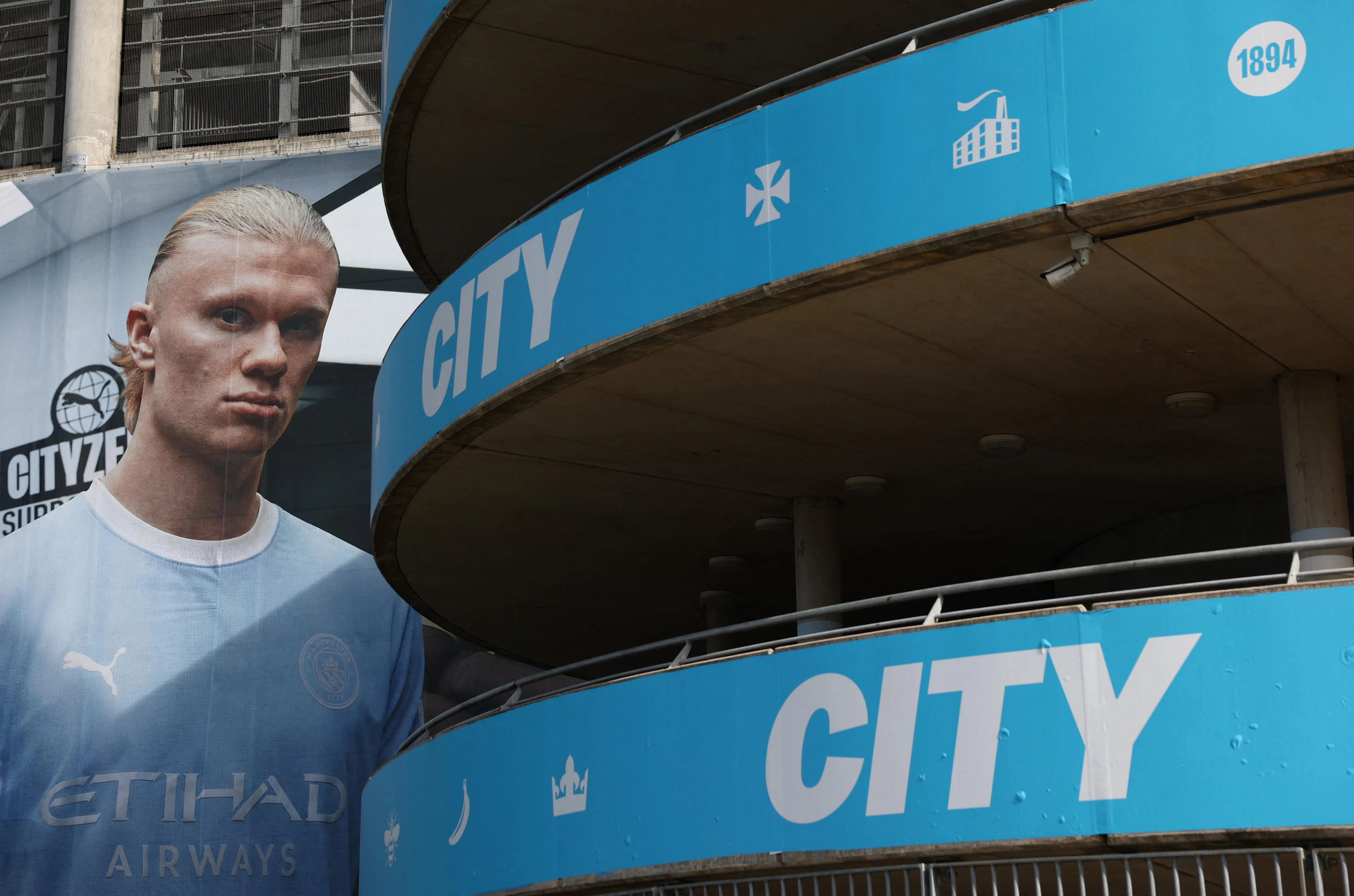 Soccer Football - General view of the Etihad Stadium, home of Manchester City football club, following Manchester City being found guilty on all but one of 115 charges over breaches of Premier League financial rules, in Manchester, Britain, September 26, 2026
A poster of Manchester City's Erling Haaland outside the stadium Action Images via Reuters/Lee Smith