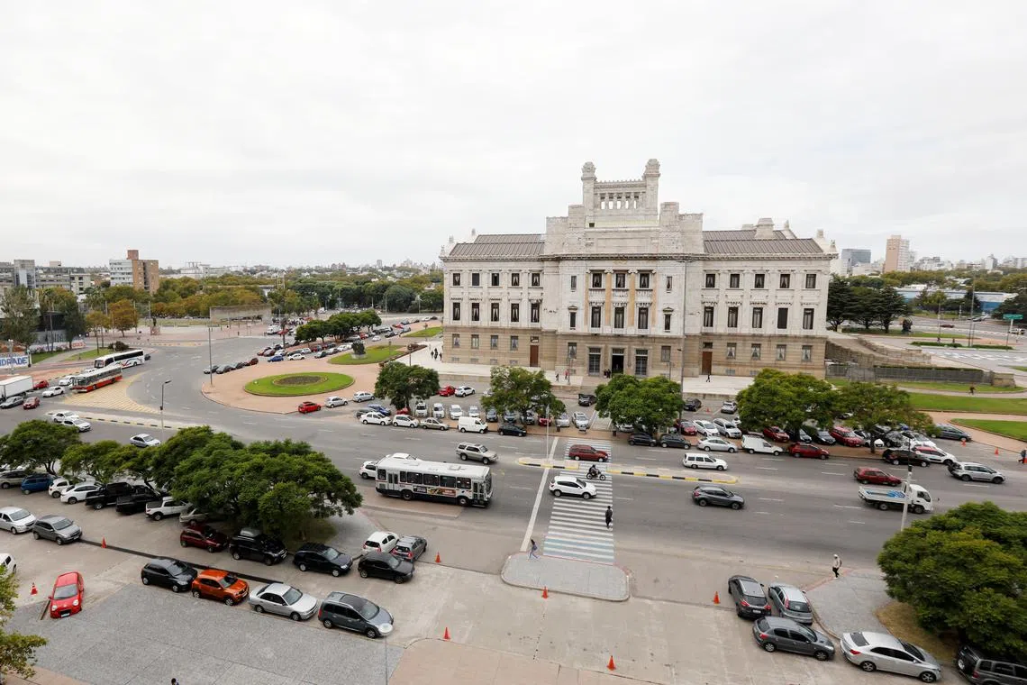 People walk in front of Uruguay's Palacio Legislativo in Montevideo, Uruguay April 23, 2019.  REUTERS/Andres Stapff/File Photo