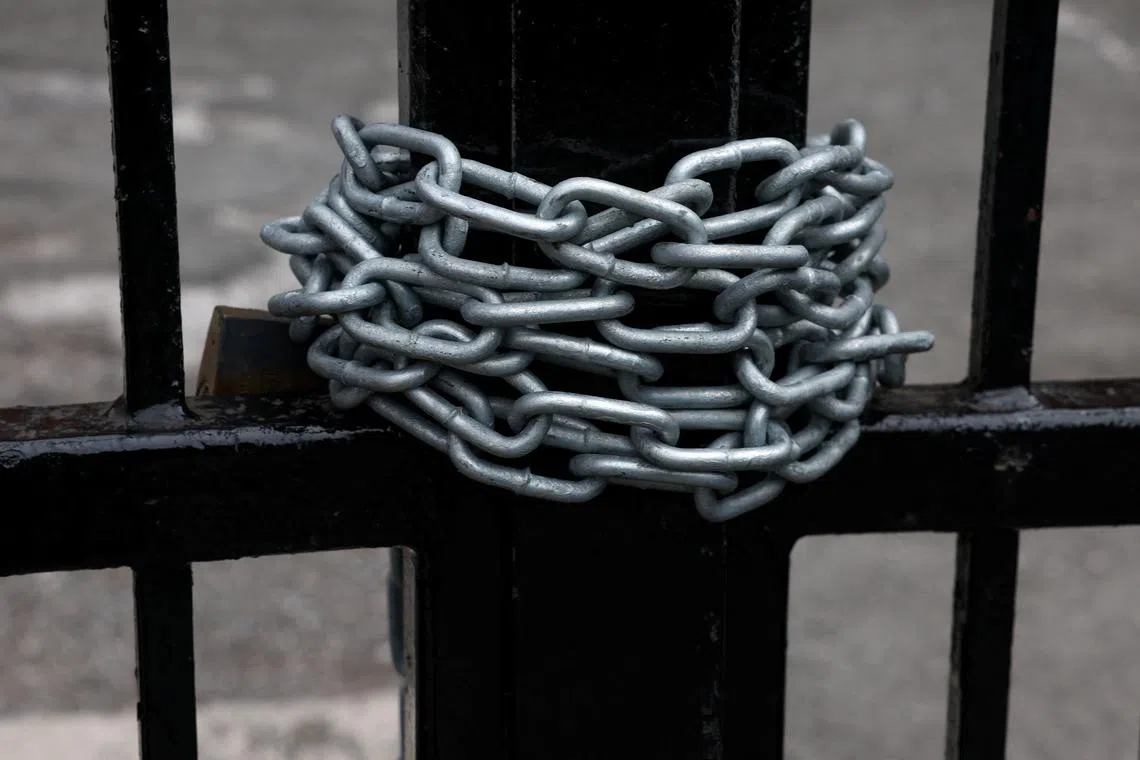 A chain is wrapped around the bars of a gate at the Abdullah Quilliam Mosque, amid rioting across the country in which mosques and Muslims have been targets, in Liverpool, Britain August 6, 2024. REUTERS/Manon Cruz