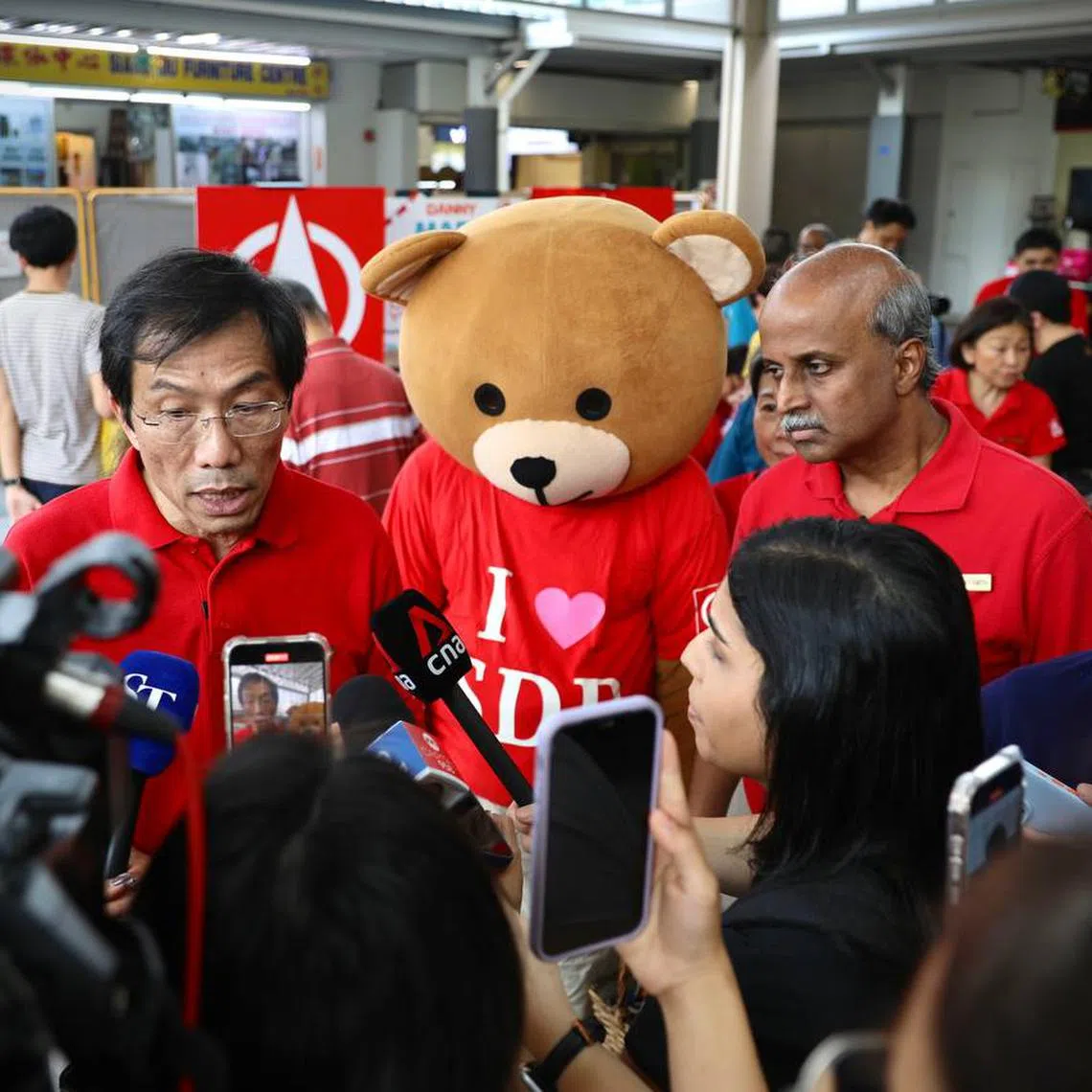 SDP party chief Chee Soon Juan and chairman Paul Tambyah speak to media at 888 Plaza at Woodlands on March 30.