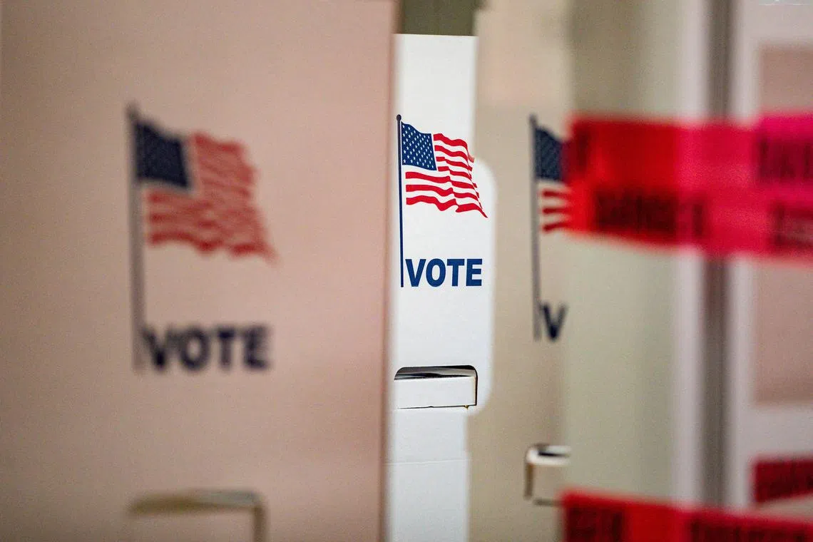 FILE PHOTO: Voting booths stand during the 2024 U.S. presidential election on Election Day at the Detroit Police Department, Twelfth Precinct in Detroit, Michigan, U.S., November 5, 2024. REUTERS/Emily Elconin/File Photo