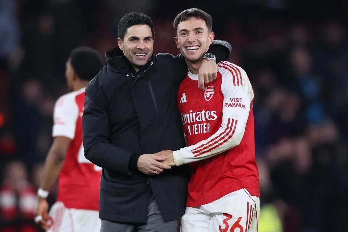 Arsenal manager Mikel Arteta and Martin Zubimendi celebrate after the match.