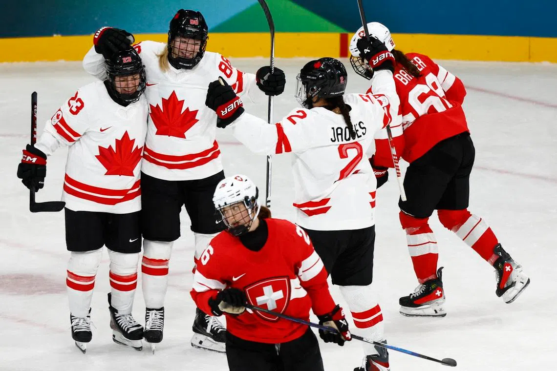 Milano Cortina 2026 Olympics - Ice Hockey - Women's Preliminary Round - Group A - Switzerland vs Canada - Milano Rho Ice Hockey Arena, Milan, Italy - February 07, 2026. Julia Gosling of Canada celebrates scoring their third goal against Switzerland with Sophie Jaques of Canada and Erin Ambrose of Canada REUTERS/Alessandro Garofalo