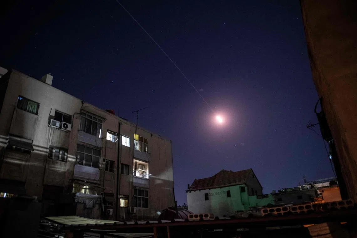 Flares of syrian air defense rockets are seen in the sky of Damascus on April 4, 2023. - Two Syrian civilians were killed in an Israeli air strike April 4, 2023, state media reported, the fourth such attack on government-held areas of the war-torn country in less than a week.
"At 00:15 (2115 GMT April 3) the Israeli enemy carried out an air strike... and the attack resulted in the death of two civilians," state news agency SANA said, quoting a military source. (Photo by STRINGER / AFP)