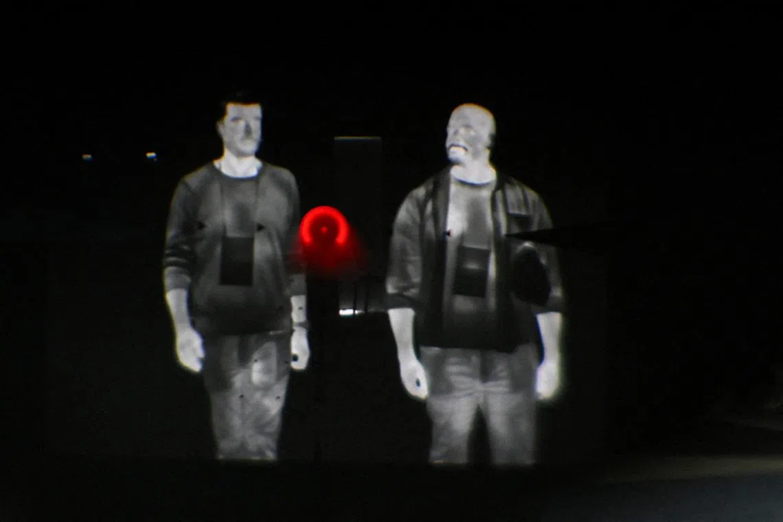 A scope with a clip-on thermal optic camera showing attendees during the National Rifle Association’s (NRA) Annual Meetings and Exhibits in Houston, Texas, US, April 19.