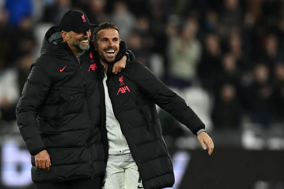 Liverpool's Jordan Henderson, pictured with manager Jurgen Klopp last season, looks headed to Saudi Arabia to join Al-Ettifaq. 