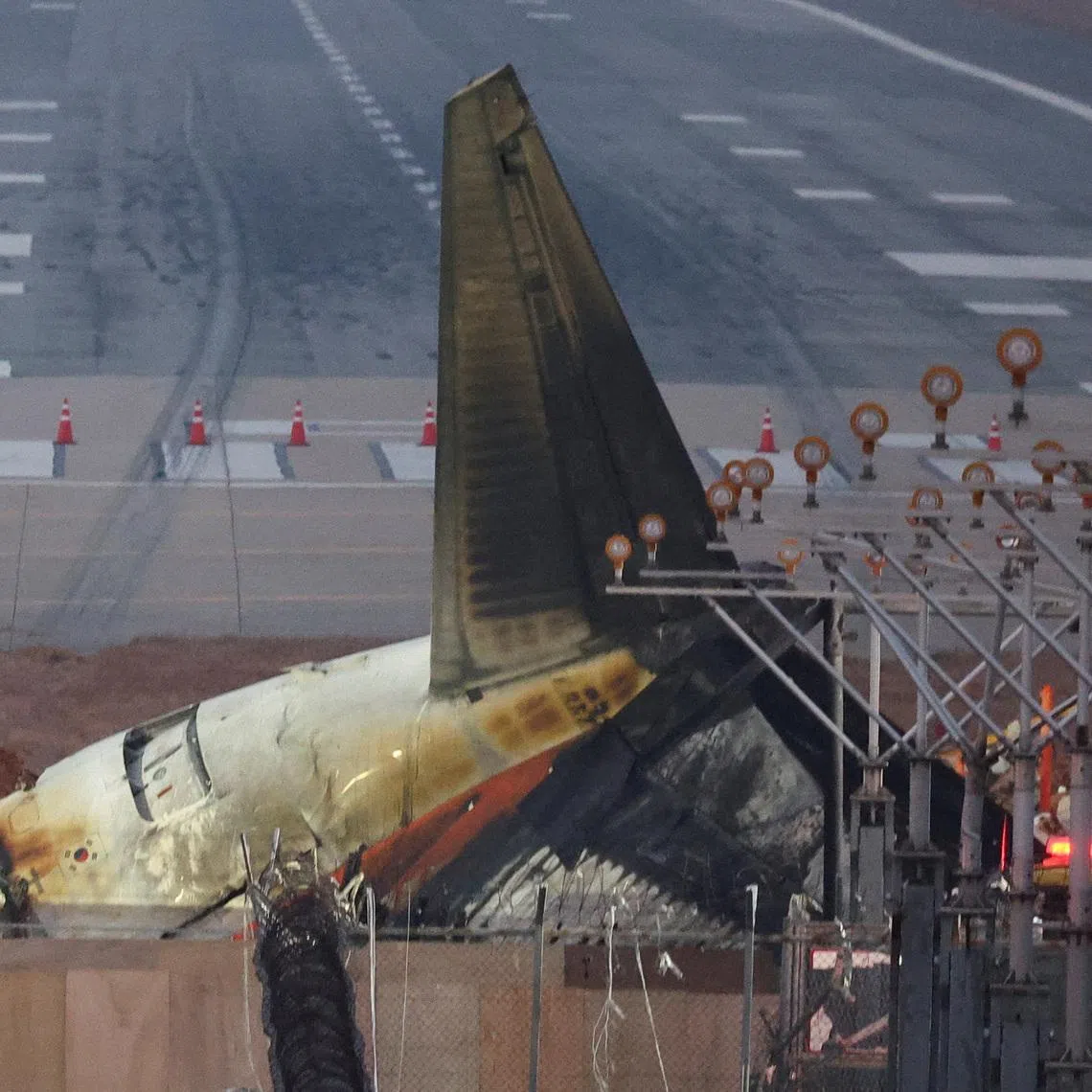 FILE PHOTO: The wreckage of the Jeju Air aircraft that went off the runway and crashed lies at Muan International Airport, in Muan, South Korea, December 30, 2024. REUTERS/Kim Hong-Ji/File Photo