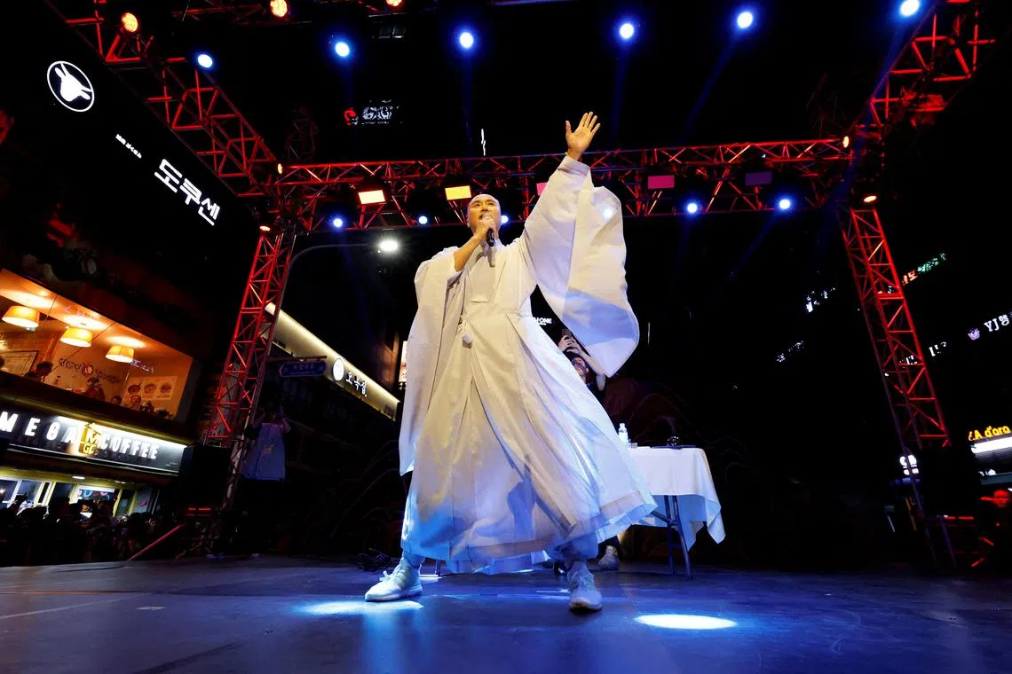 Youn Sung-ho, known as NewJeansNim, gets people pumped up for an EDM party with the teachings of Buddha.