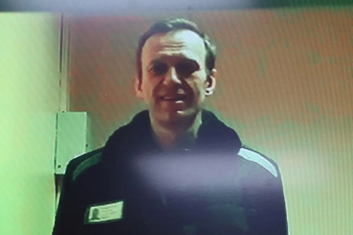 FILE PHOTO: Russian opposition leader Alexei Navalny is seen on a screen via video link from a penal colony in the Vladimir Region during a hearing at the Basmanny district court in Moscow, Russia April 26, 2023. REUTERS/Yulia Morozova