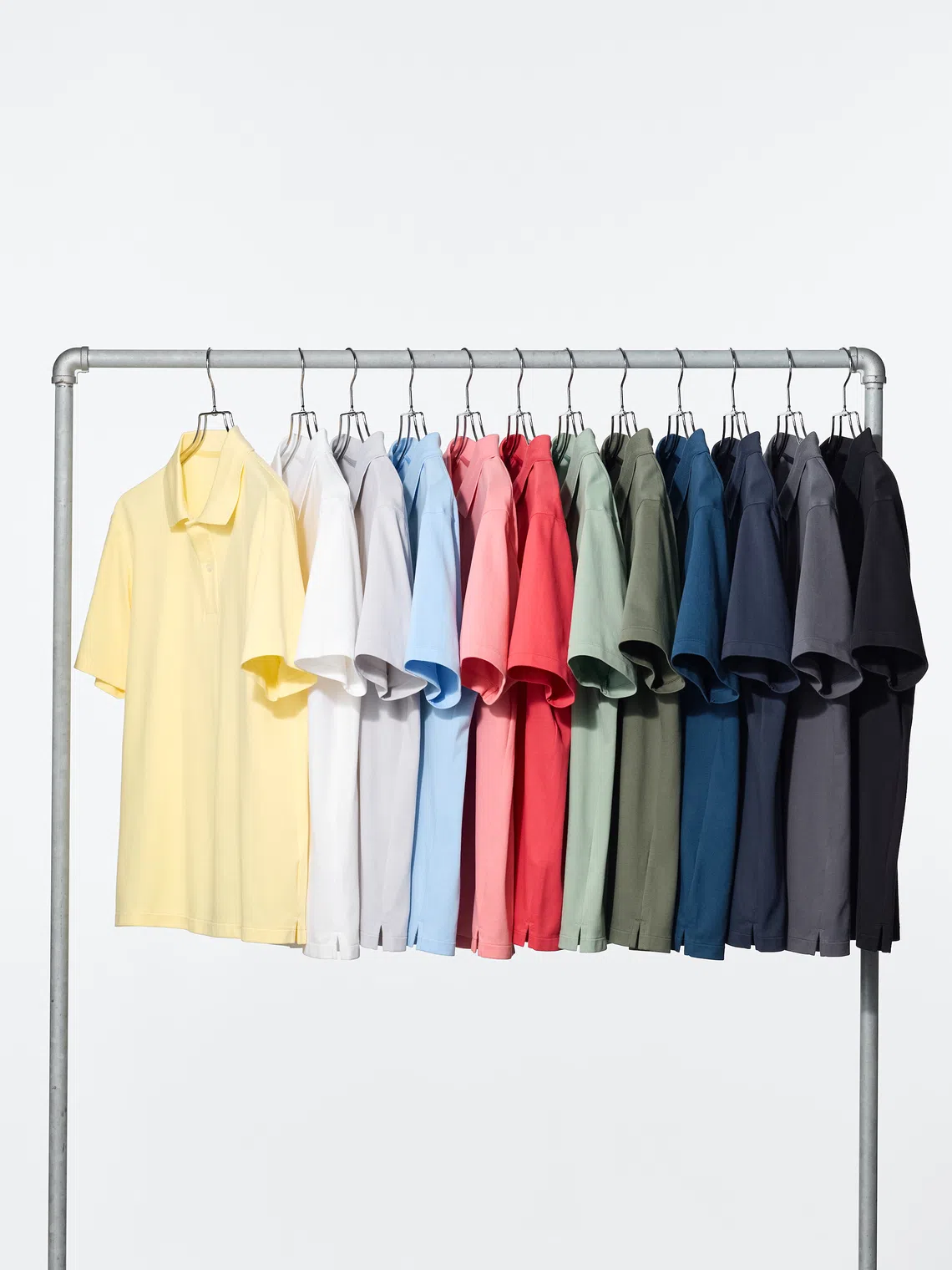 Rack of Uniqlo Airism Cotton Pique Polo Shirts, popular with Singaporean men.