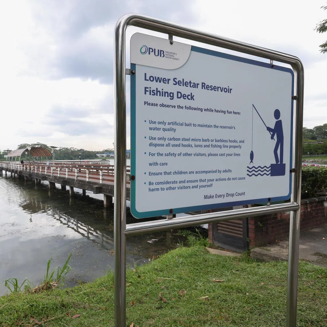 Photo of a PUB sign with Lower Seletar Reservoir Fishing Deck in the background on Mar 6, 2026.