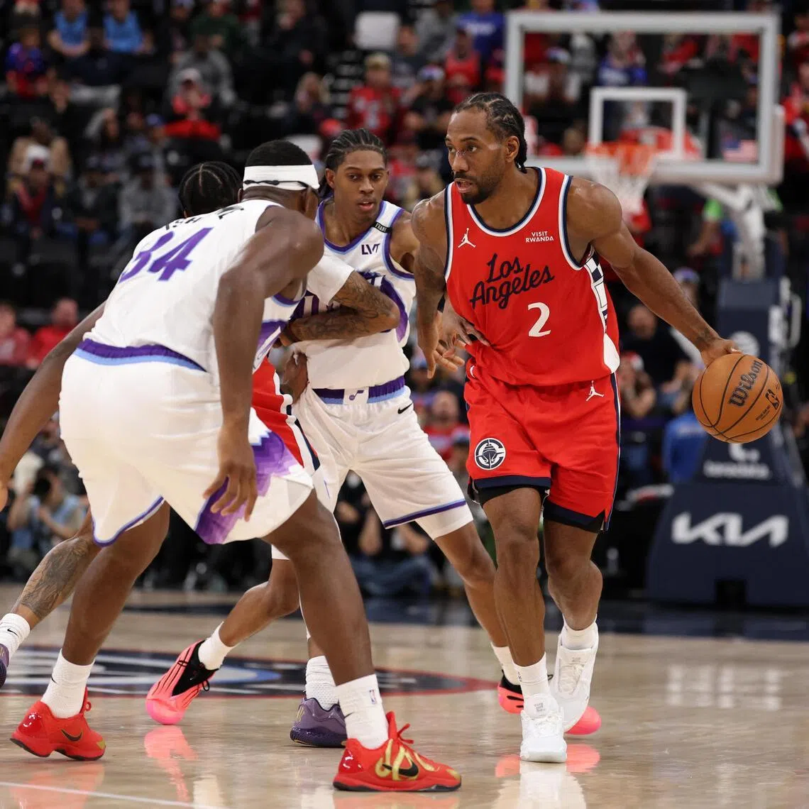 Los Angeles Clippers forward Kawhi Leonard dribbles the ball against Utah Jazz forward Oscar Tshiebwe during the second half at Intuit Dome. 
