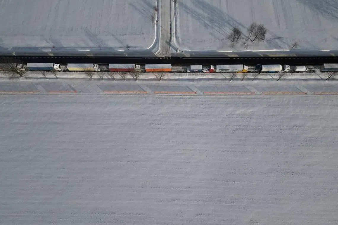 Trucks line up in a long queue to cross the Polish-Ukrainian border at the Hrebenne-Rawa Ruska crossing in Potoki, Poland, January 8, 2024. REUTERS/Kacper Pempel