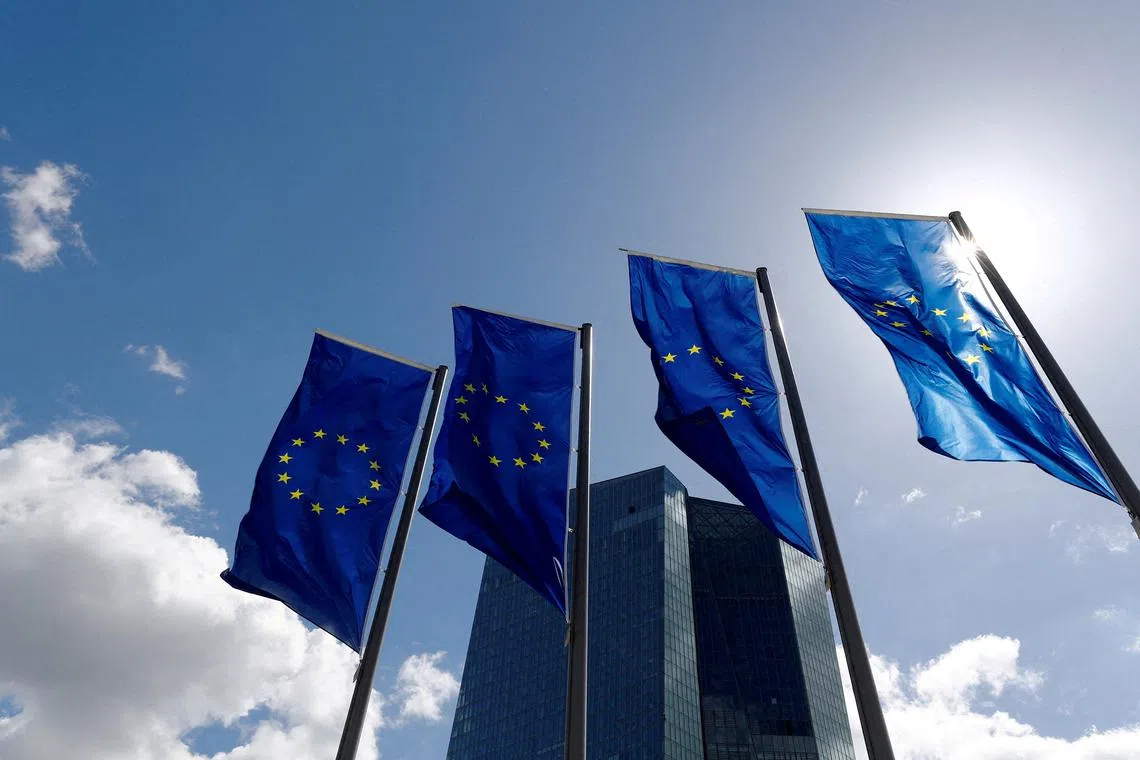FILE PHOTO: European Union flags flutter outside the European Central Bank (ECB) headquarters in Frankfurt, Germany, April 26, 2018. REUTERS/Kai Pfaffenbach//File Photo