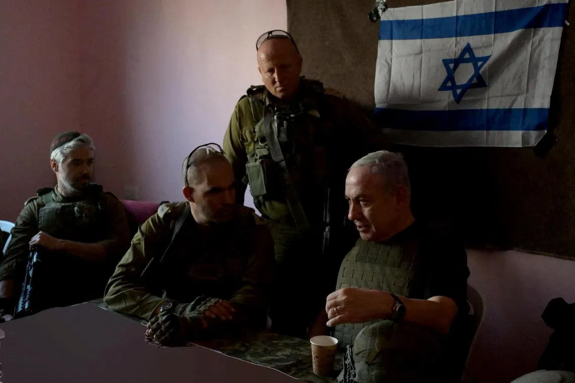 FILE PHOTO: Israeli Prime Minister Benjamin Netanyahu visits Gaza Strip, during a temporary truce between Hamas and Israel, in this handout obtained by Reuters on November 26, 2023. Avi Ohayon/GPO/Handout via REUTERS/File Photo