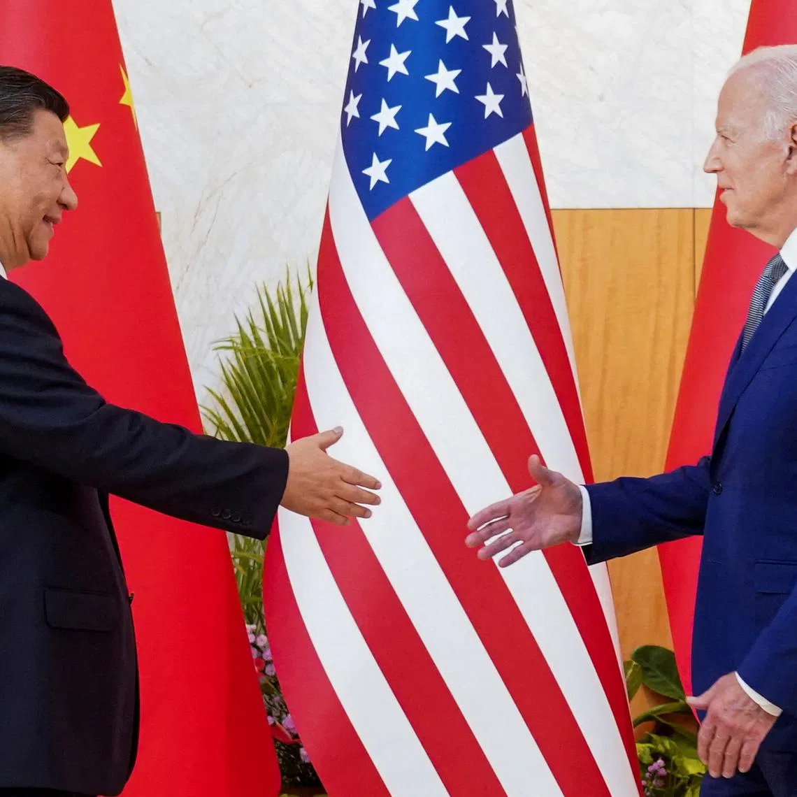 China President Xi Jinping (left) and US President Joe Biden meet on the sidelines of the G-20 Summit in Nusa Dua on Nov 14, 2022.