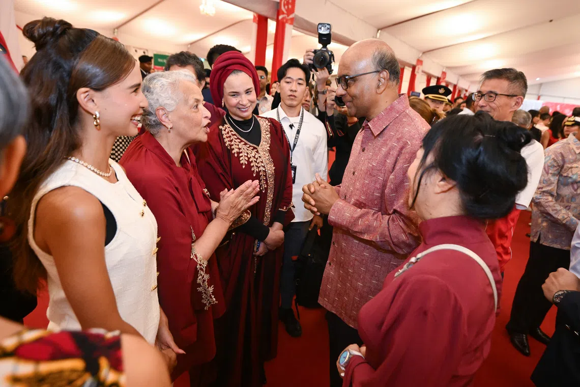 President Tharman Shanmugaratnam (second from right) and his spouse Jane Ittogi Shanmugaratnam (far right) with (from left) Iman Fandi, Charmine Jacobs and Wendy Jacobs during the National Day Reception at the Istana on Aug 10.