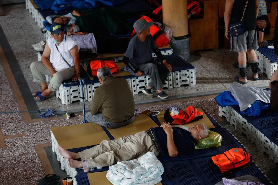 Residents at a church, turned into a temporary evacuation centre in preparation for Typhoon Bavi, in Taiwan’s Hualien county on July 10.