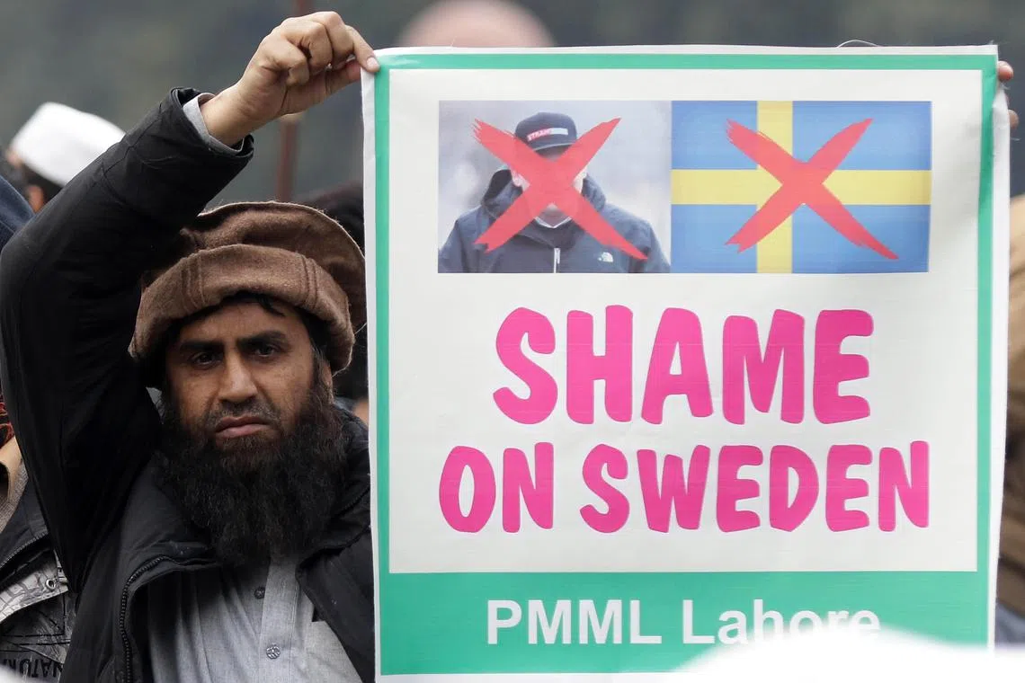 People demonstrate against Sweden in Lahore, Pakistan, following Rasmus Paludan's Quran-burning protest. 
