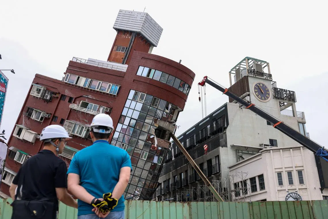 Heavy equipment are being used to demolish the Uranus building, which was damaged in the April 3 earthquake, in Hualien on April 5, 2024. 