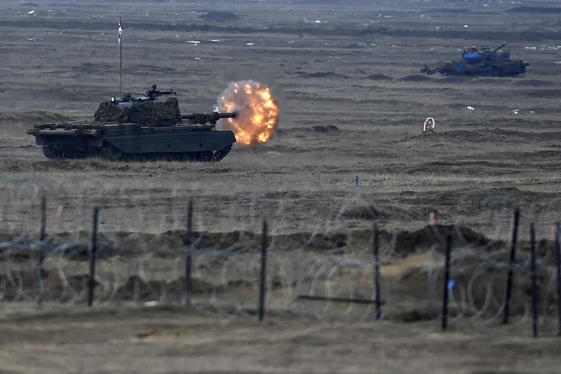 FILE PHOTO: A Romanian tank fires it's main gun during NATO's 'Steadfast Dart 2025' exercise at Smardan training range, near Galati, Romania, 19 February 2025. Inquam Photos/Eduard Vinatoru via REUTERS