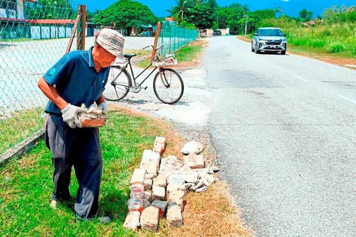 Kind-hearted resident: Malaysia’s ‘Loh Mai Kai’ fills potholes for safer roads