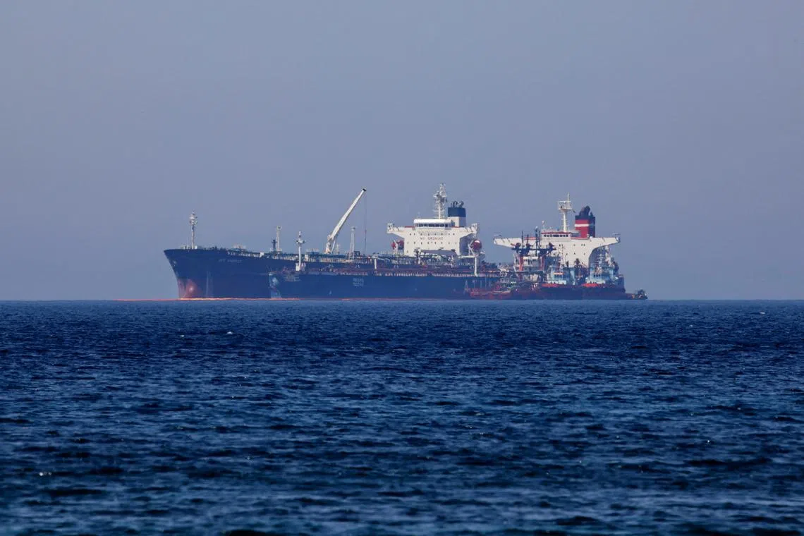 FILE PHOTO: The Liberian-flagged oil tanker Ice Energy transfers crude oil from the Iranian-flagged oil tanker Lana (former Pegas), off the shore of Karystos, on the Island of Evia, Greece, May 26, 2022. REUTERS/Costas Baltas/File Photo