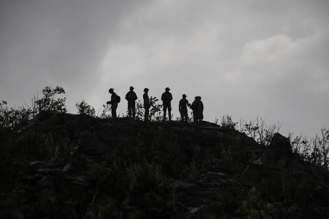 The hikers were doing what human beings have always done, reaching toward the edges of their world to feel something real, says the writer.