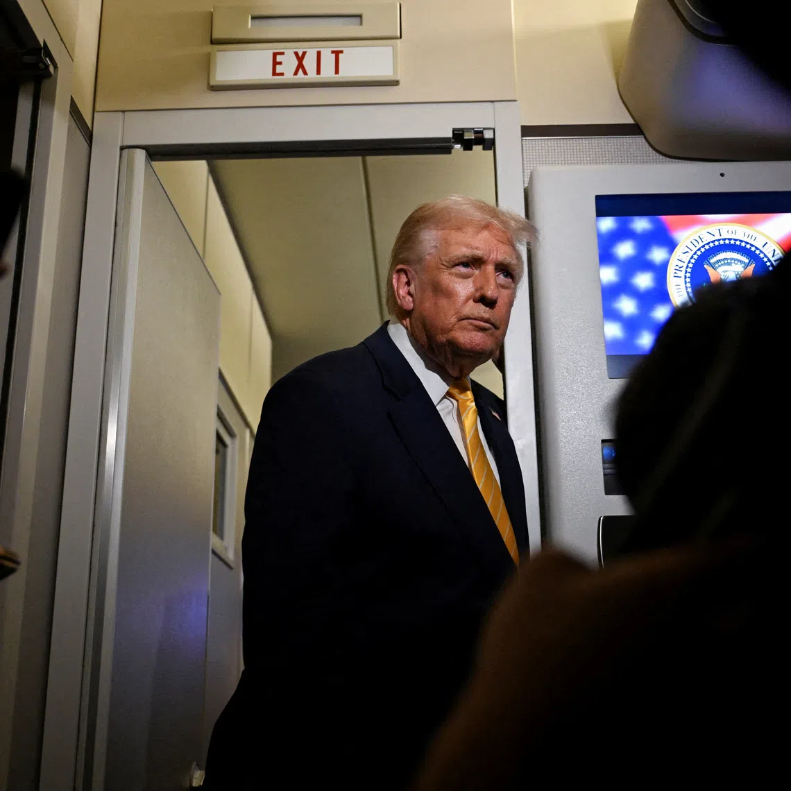 U.S. President Donald Trump talks to members of the press on board Air Force One en route to Florida, U.S., November 14, 2025. REUTERS/Annabelle Gordon/File Photo