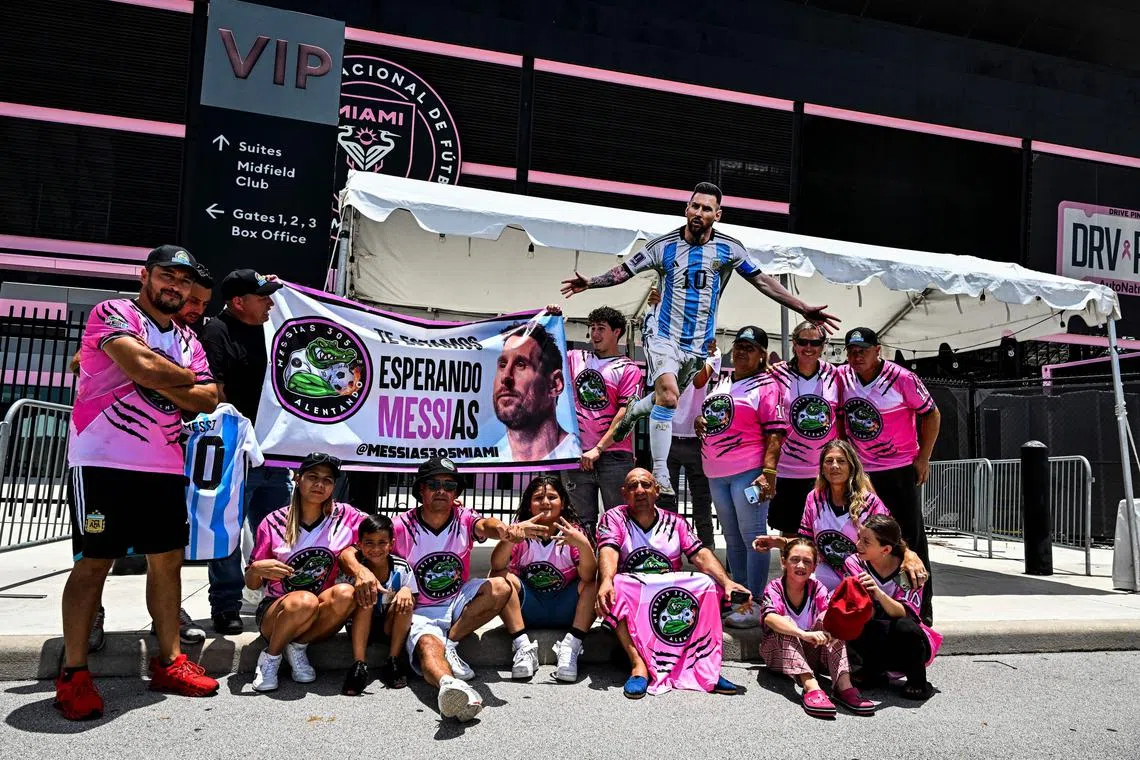 Fans of Argentina's Lionel Messi wait for his arrival at the DRV PNK Stadium in Fort Lauderdale, Florida on July 11, 2023, ahead of his debut in the Major League Soccer (MLS) with Inter Miami. Inter Miami, announced July 7, 2023, it will hold a presentation event, called 'The Unveil', on July 16 at its home stadium. Messi said last month that he was moving to the MLS club after allowing his contract at Paris Saint-Germain to run out. (Photo by CHANDAN KHANNA / AFP)
