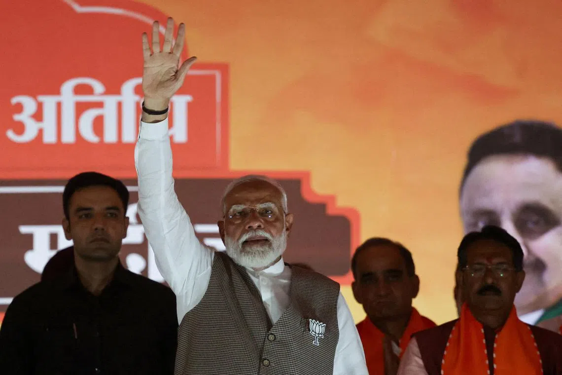 FILE PHOTO: India's Prime Minister Narendra Modi greets his supporters during an election campaign rally, in New Delhi, India, May 18, 2024. REUTERS/Anushree Fadnavis/File Photo