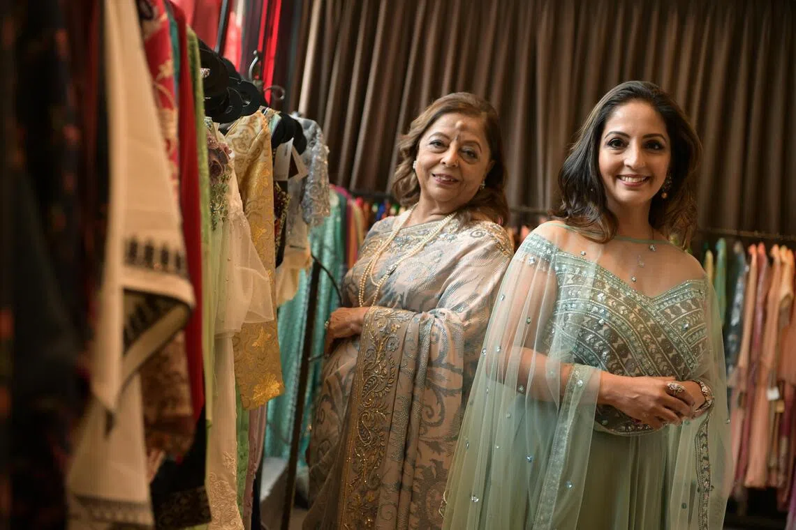 A 2021 photo of Indian fashion boutique Stylemart’s managing director and fashion designer, Kavita Thulasidas (right), with her mother, Huri Baxani.