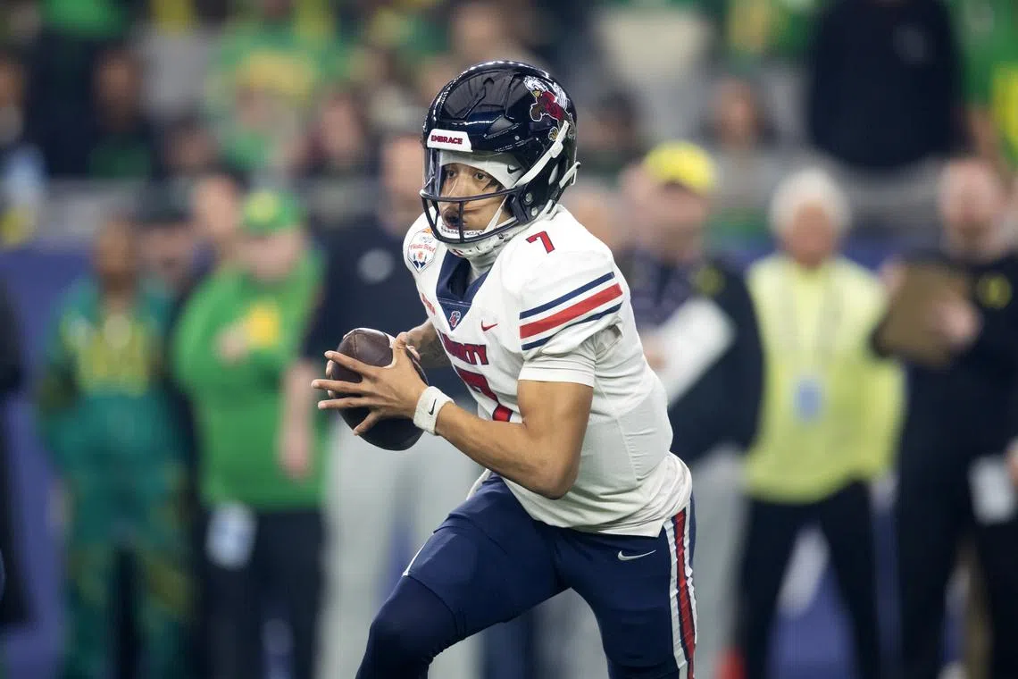 Jan 1, 2024; Glendale, AZ, USA; Liberty Flames quarterback Kaidon Salter (7) against the Oregon Ducks in the 2024 Fiesta Bowl at State Farm Stadium. Mark J. Rebilas-USA TODAY Sports/File Photo