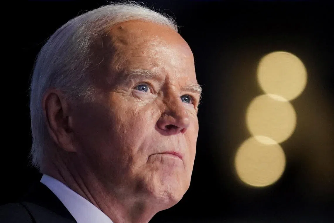 FILE PHOTO: U.S. President Joe Biden looks on as he speaks at the Democratic National Convention (DNC) in Chicago, Illinois, U.S., August 19, 2024. REUTERS/Kevin Lamarque/File Photo