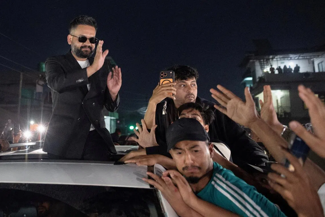 Balendra Shah, a rapper-turned-politician and the prime ministerial candidate for Rastriya Swatantra Party (RSP), greets his supporters as he celebrates after winning the election, in Damak, Jhapa district, Nepal, March 7, 2026. REUTERS/Adnan Abidi