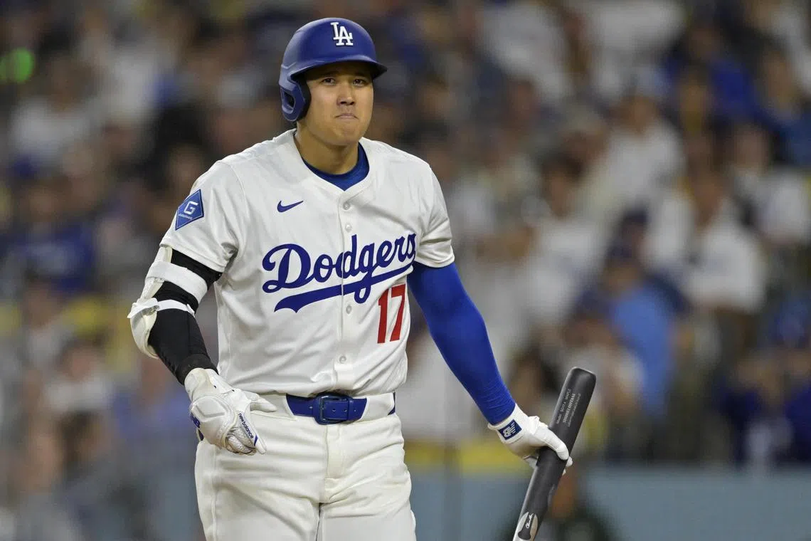 Los Angeles Dodgers designated hitter Shohei Ohtani reacts after striking out in the sixth inning against the San Diego Padres at Dodger Stadium. 