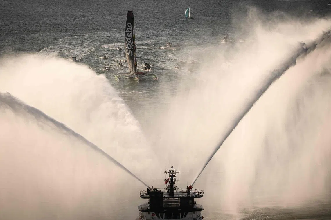 French rescue tugboat Abeille Bretagne spraying water to welcome French skipper Thomas Coville and his crew members' arrival in Brest harbour, after crossing the finish line of their successful attempt of breaking the Jules Verne Trophy record in 40 days, 10 hours and 45 minutes, off the coast of Brest, Brittany, on Jan 25, 2026. 