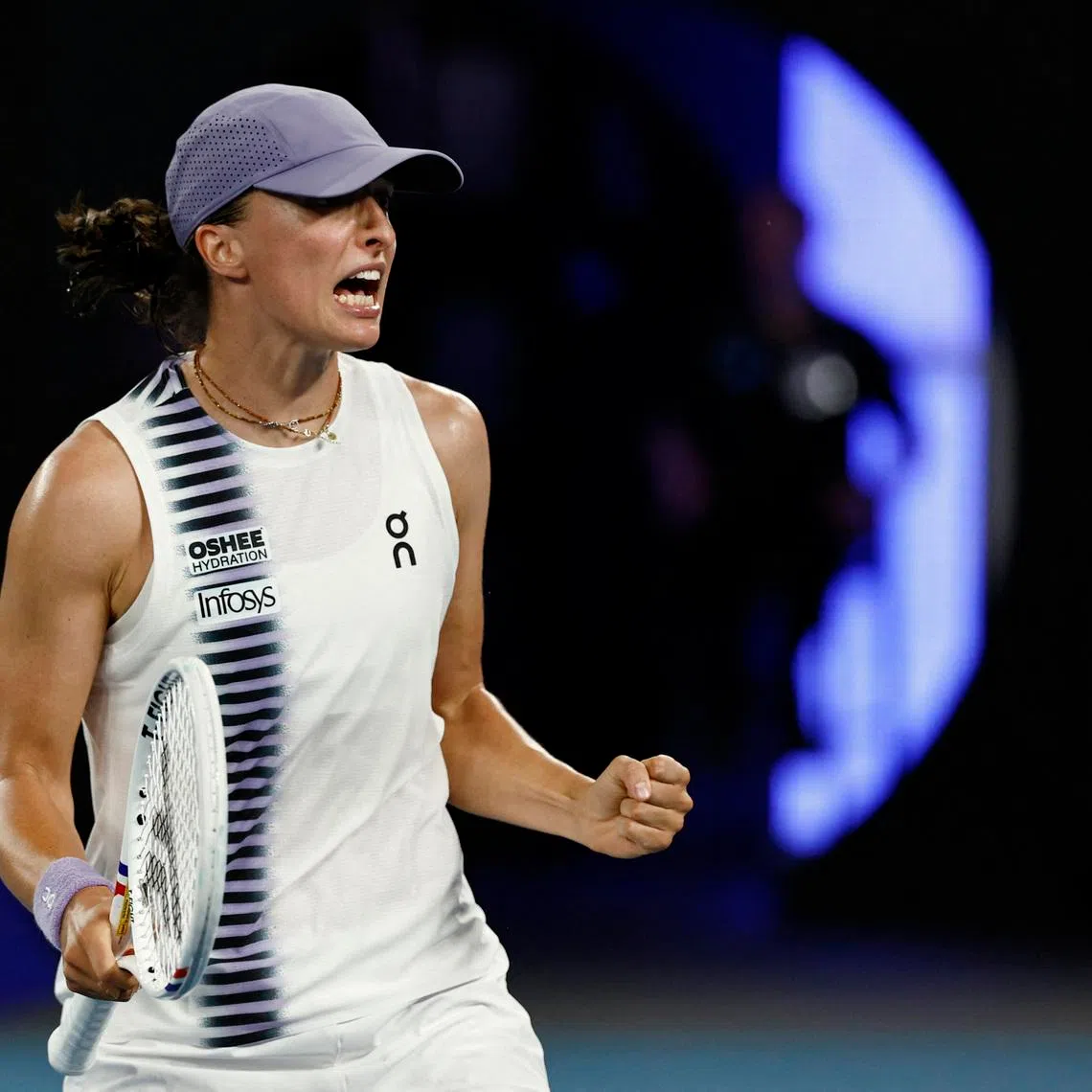Tennis - Australian Open - Melbourne Park, Melbourne, Australia - January 19, 2026 Poland's Iga Swiatek celebrates after winning her first round match against China's Yue Yuan REUTERS/Tingshu Wang