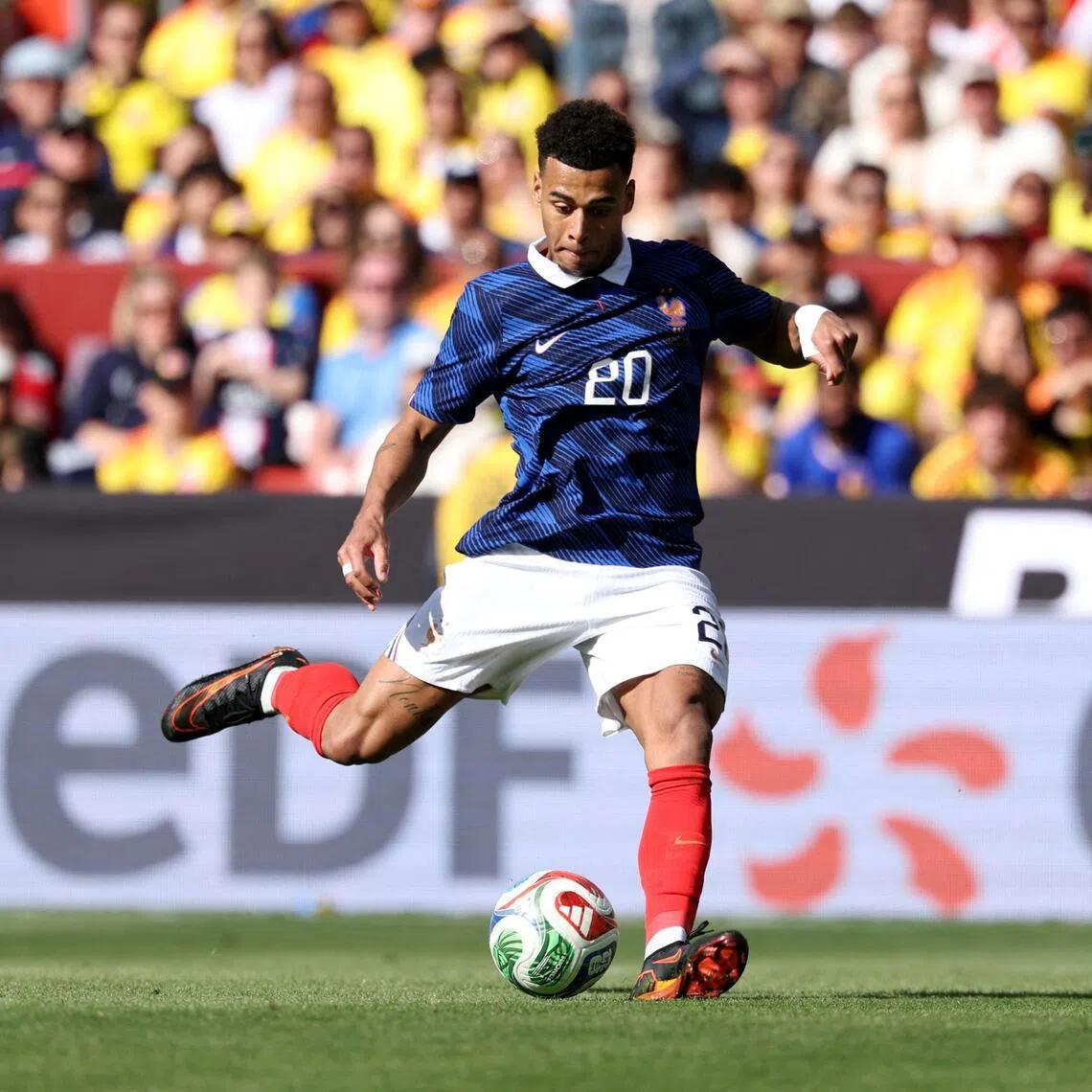France's Desire Doue shoots to score his second goal on March 29, during a friendly football match against Colombia in the US.
