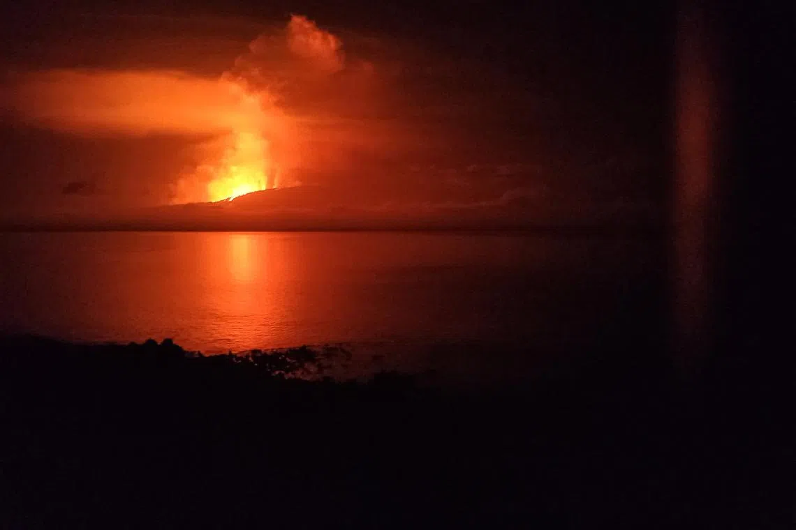 A view shows la cumbre volcano erupting and spewing lava, as seen from Isabela Island in Galapagos, Ecuador, March 3, 2024. Parque Nacional Galapagos/Andy Torres /Handout via REUTERS