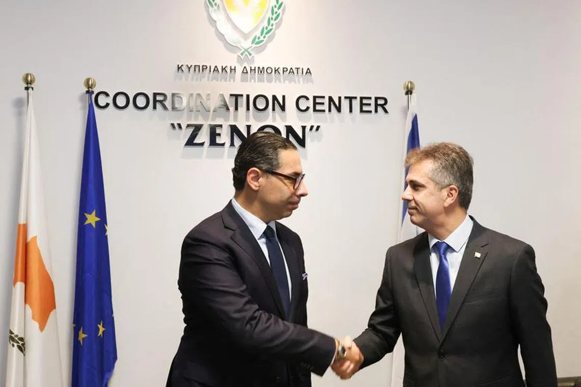 Cyprus' Foreign Minister Constantinos Kombos welcomes his Israeli counterpart Eli Cohen in Larnaca, Cyprus, December 20, 2023. Stavros Ioannides/PIO/Handout via REUTERS