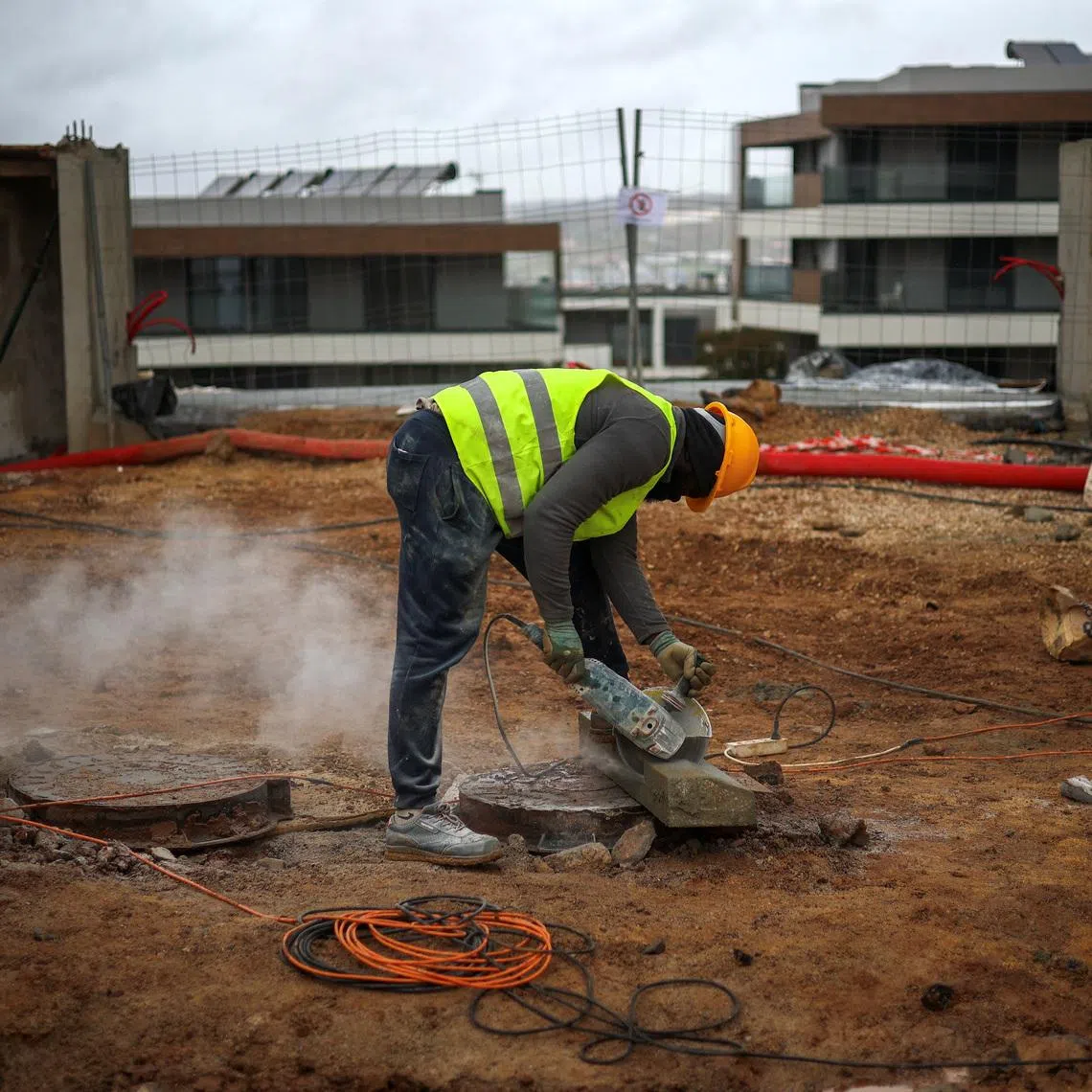 A man works on a construction site in Lisbon, Portugal, November 24, 2025. REUTERS/Pedro Nunes