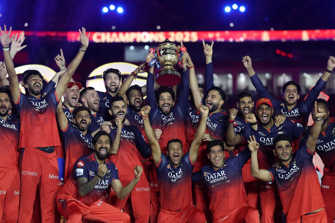 Cricket - Indian Premier League - IPL - Final - Royal Challengers Bengaluru v Punjab Kings - Narendra Modi Stadium, Ahmedabad, India - June 4, 2025 Royal Challengers Bengaluru's Rajat Patidar lifts the trophy as he celebrates with teammates after winning the Indian Premier League REUTERS/Amit Dave