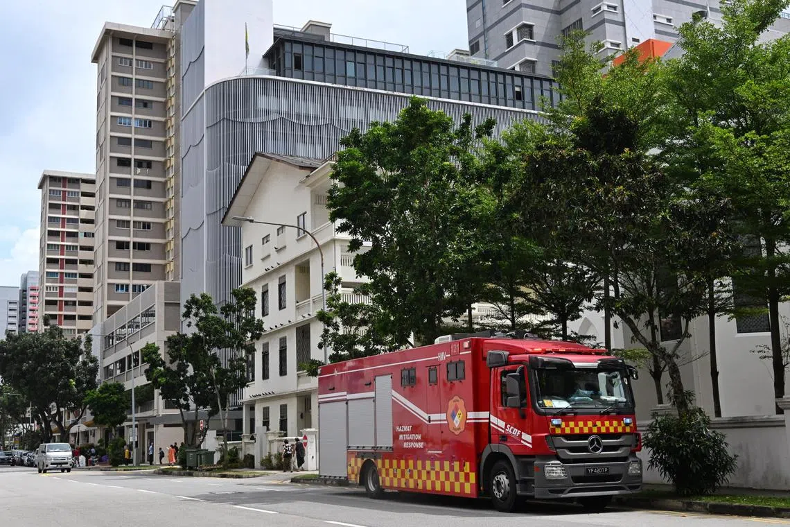 Slug: pixpowder
ST PHOTO: Chong Jun Liang

A SCDF Fire engine is seen near The Catholic Centre on January 18, 2023 

SCDF guys in hazmat suits are investigating a white powder/substance left on the ground at Waterloo St. Reporter is Keng Gene