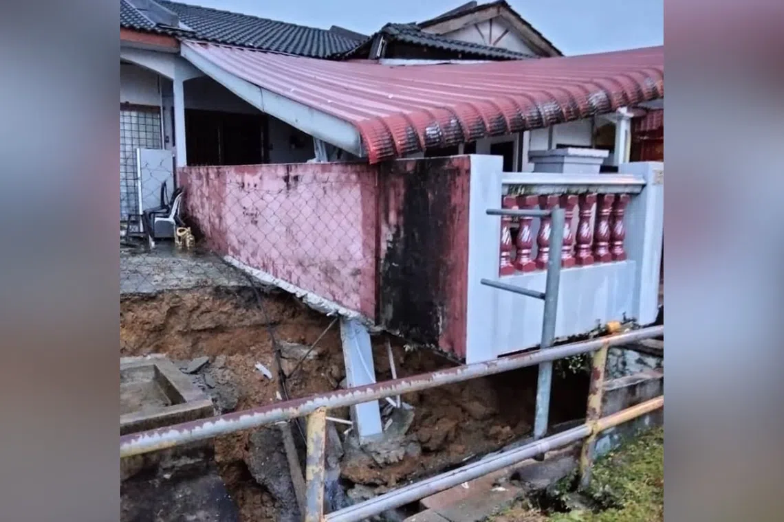 A big chunk of the porches of two houses caved in during a downpour.
