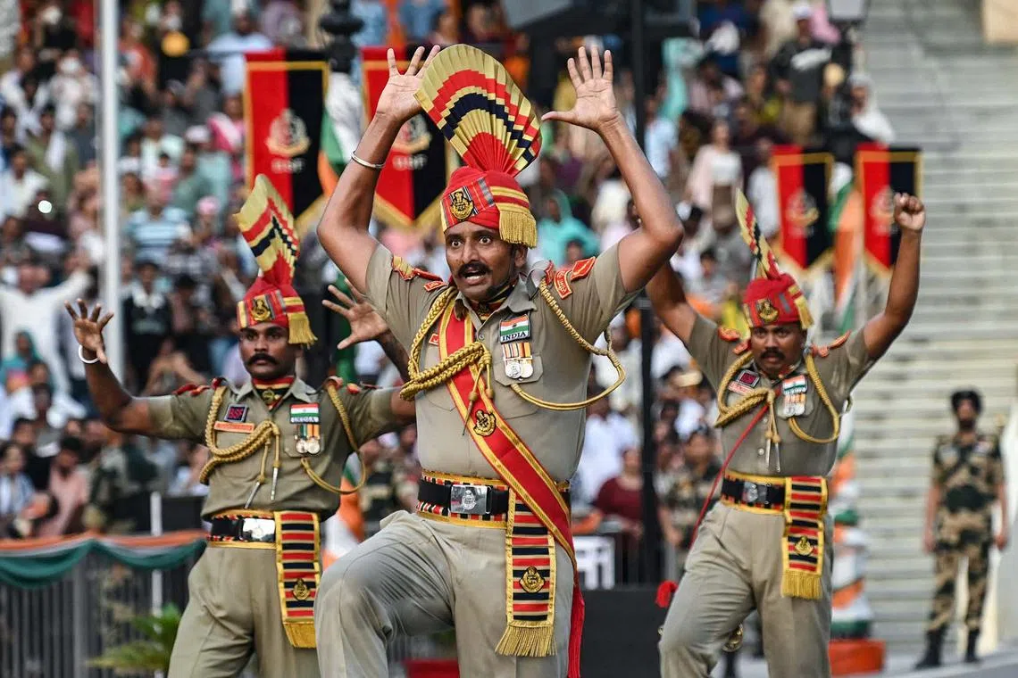 India's Border Security Force taking part in the Beating Retreat ceremony on the occasion of Pakistan's Independence Day and eve of India's Independence Day at the India-Pakistan Wagah border post, about 35km from Amritsar on Aug 14, 2024.
