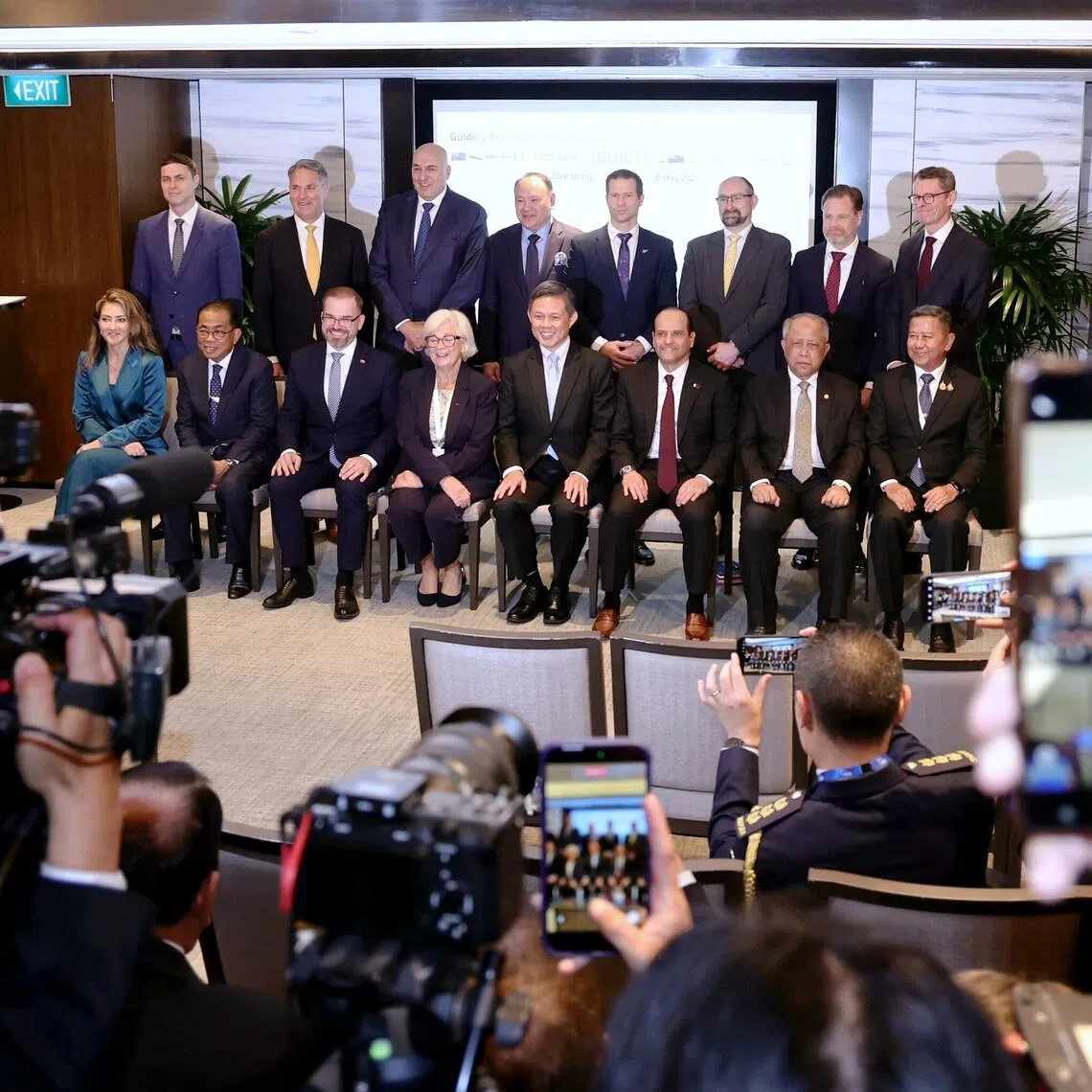 Defence Minister Chan Chun Sing (seated, fourth from right) with counterparts and representatives from the other countries involved in the Guiding Principles for Underwater Infrastructure Defence Exchanges.